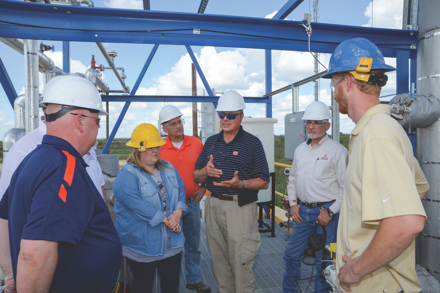Bruce Tatarchuk, center, discusses the technology surrounding a demonstration site located in Texas about an hour out of San Anto- nio in the Eagle Ford shale formation. Pictured from left are Mario Eden, chair of the Department of Chemical Engineering; resident engineer Kylie Webb; Brian Wright, director of commercialization in Auburn’s Office of Innovation Advancement and Commercialization; Tatarchuk; Steve Taylor, associate dean of research in the College of Engineering, and resident engineer Harrison Wright.