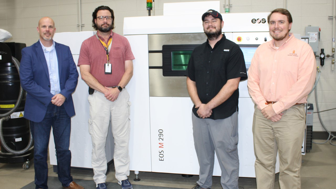 Team members from NCAME, Huntsville City Schools, and EOS worked together to bring online the district’s second industrial 3D printer at Grissom High School. From left: Todd Watkins, director of Career Technical Education for Huntsville City Schools; Chris Faust, additive manufacturing teacher at Grissom High School; Garrett Heath, technician at EOS North America, and Lee Fleming, graduate research assistant for NCAME.