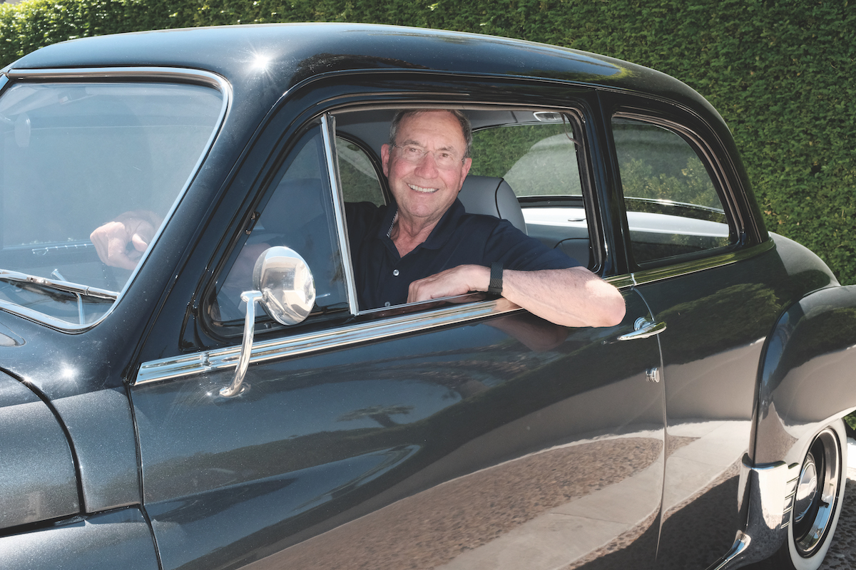 Sam Ginn in his 1950 Plymouth Deluxe.