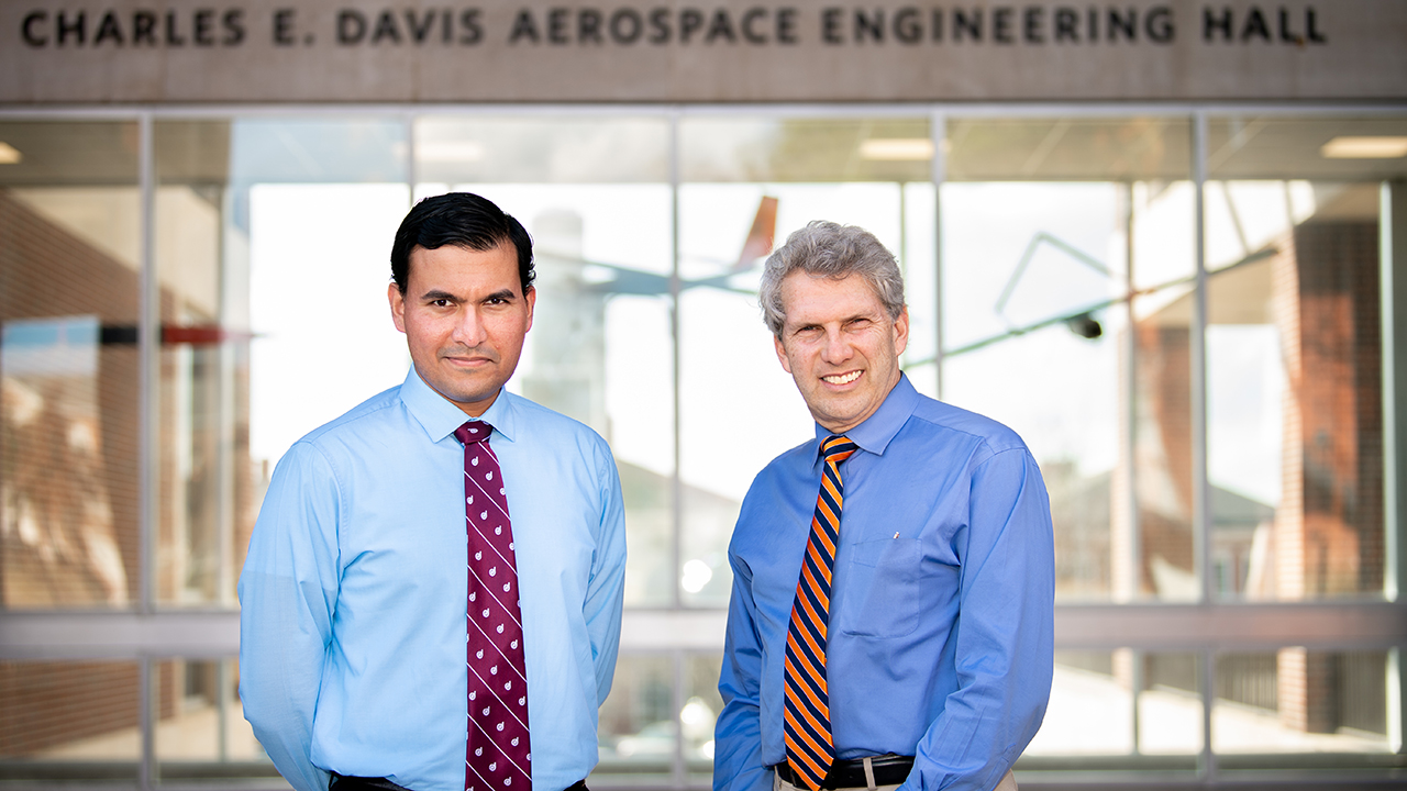 Aerospace engineering professors Imon Chakraborty and Roy Hartfield pose on the campus of Auburn University.